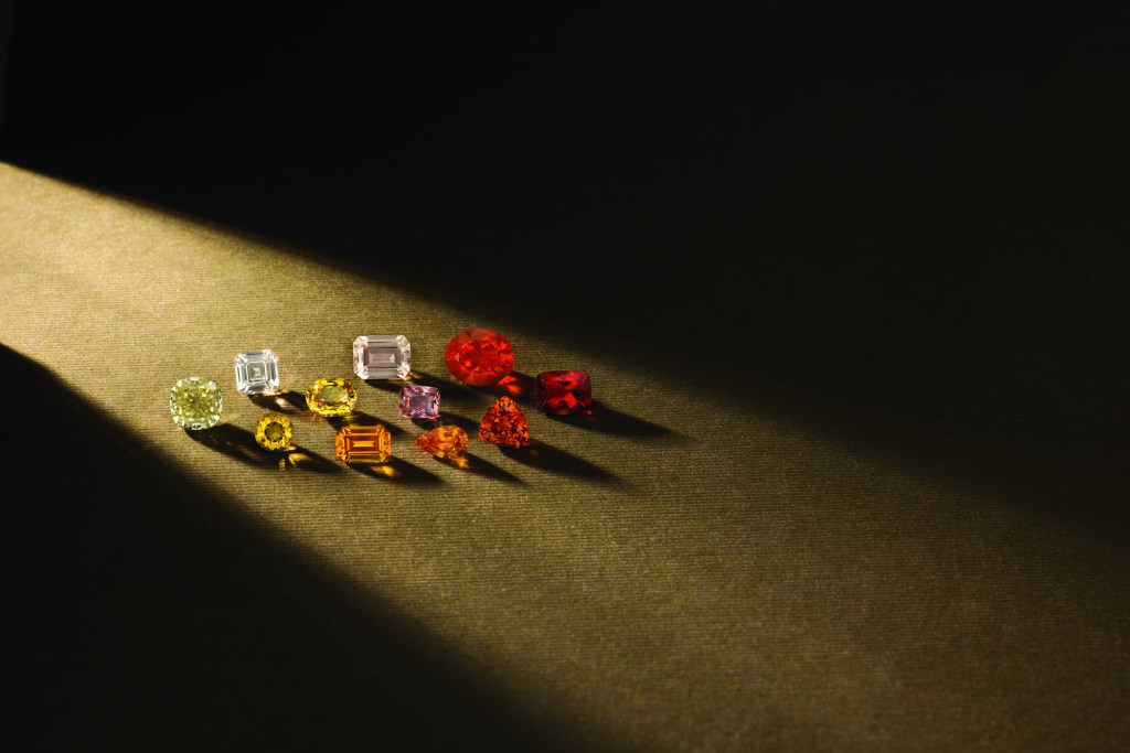Loose colored gemstones in dramatic light